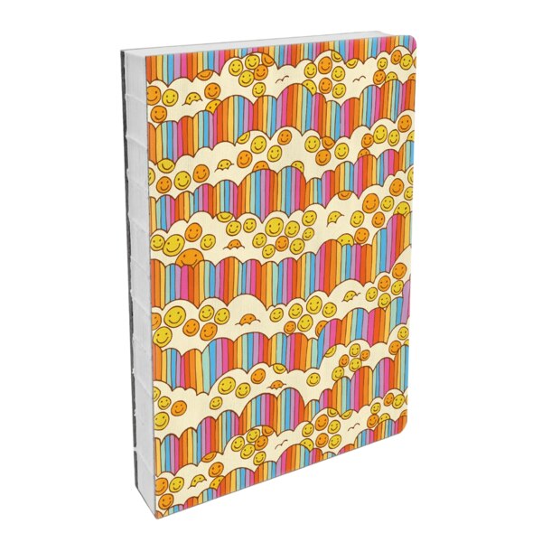 front of hardcover notebook with a slight texture, rainbow stripes up and down with cloud like cut outs that have yellow and orange smiley faces in them